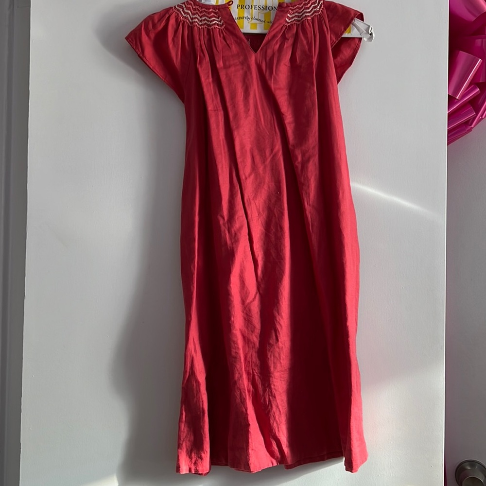 This is a Jacadi pink dress and it is very cute!